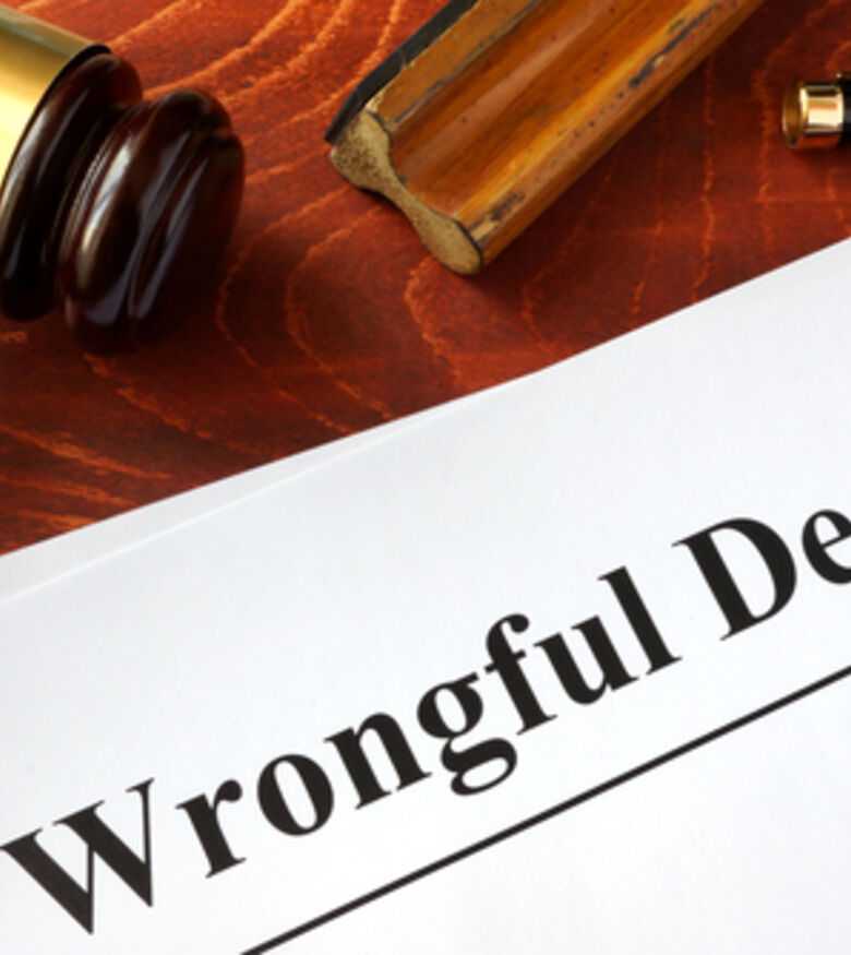 Wrongful death claim form with gavel, consult an attorney in Grand Rapids.