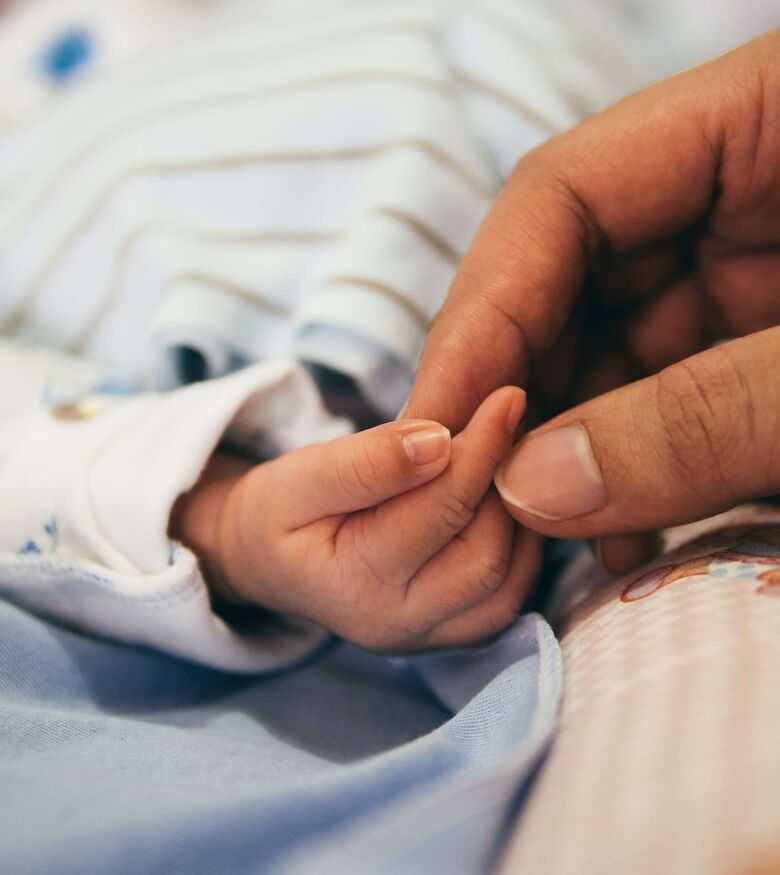 Failure to Monitor - newborn baby holding hand