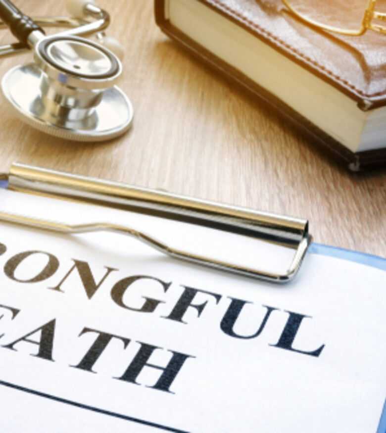 Wrongful death lawsuit papers with scales of justice, contact an attorney in Reno.