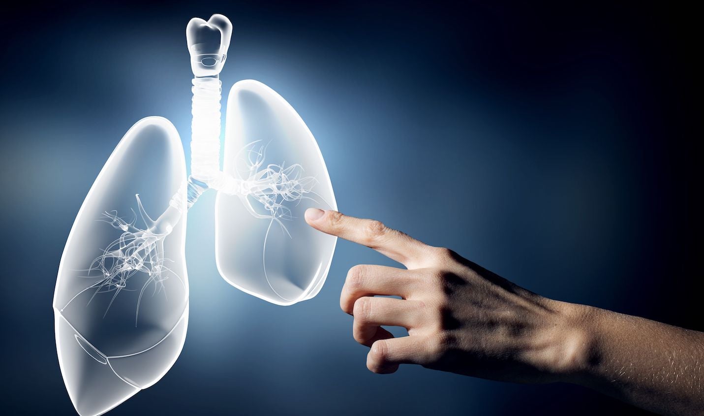 Man pointing at lungs