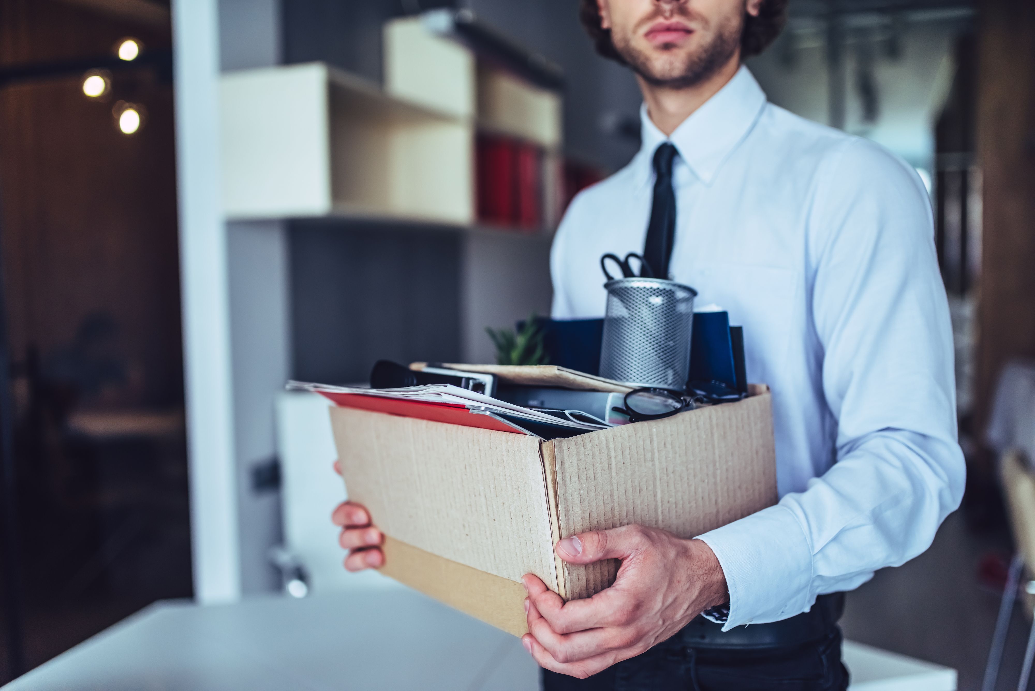 Man with Box of office supplies