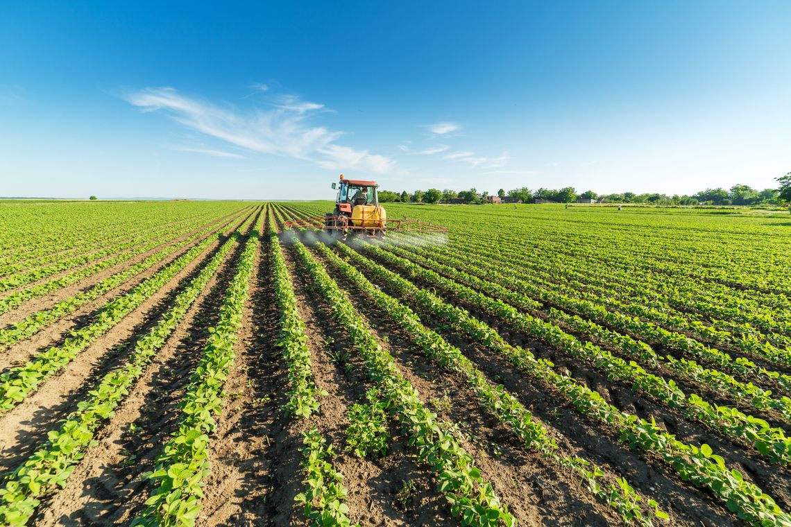 farmer spraying crops