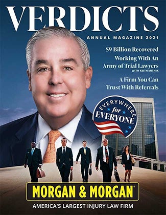 John Morgan and his top staff on the cover of the 2021 Verdicts Magazine