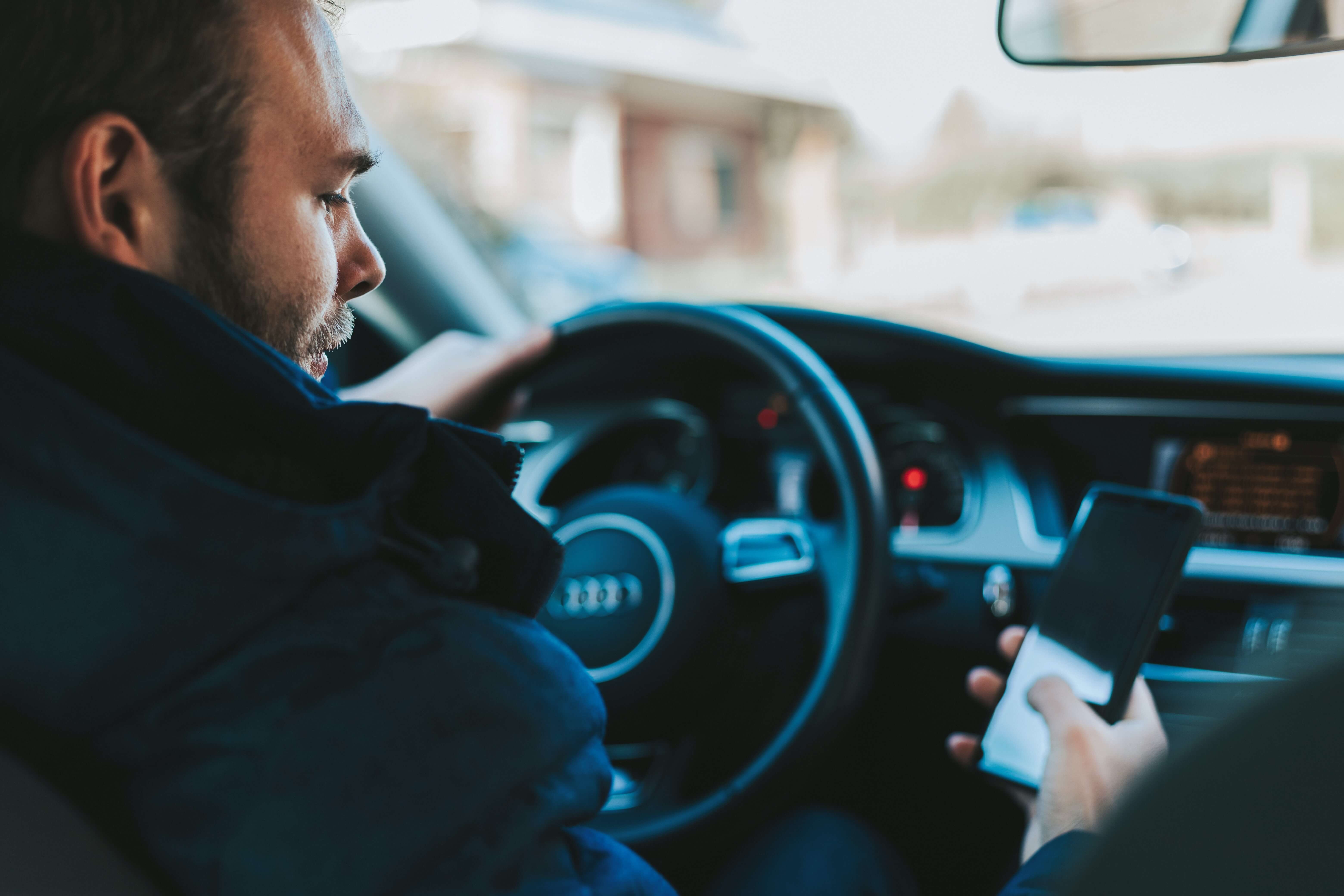 a man texting and driving