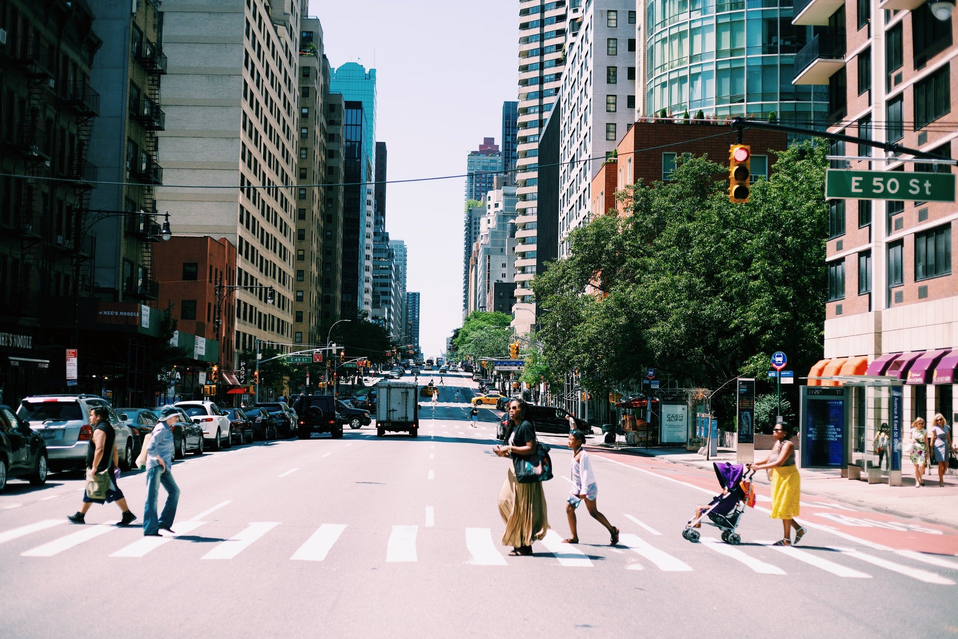pedestrian walking across the street