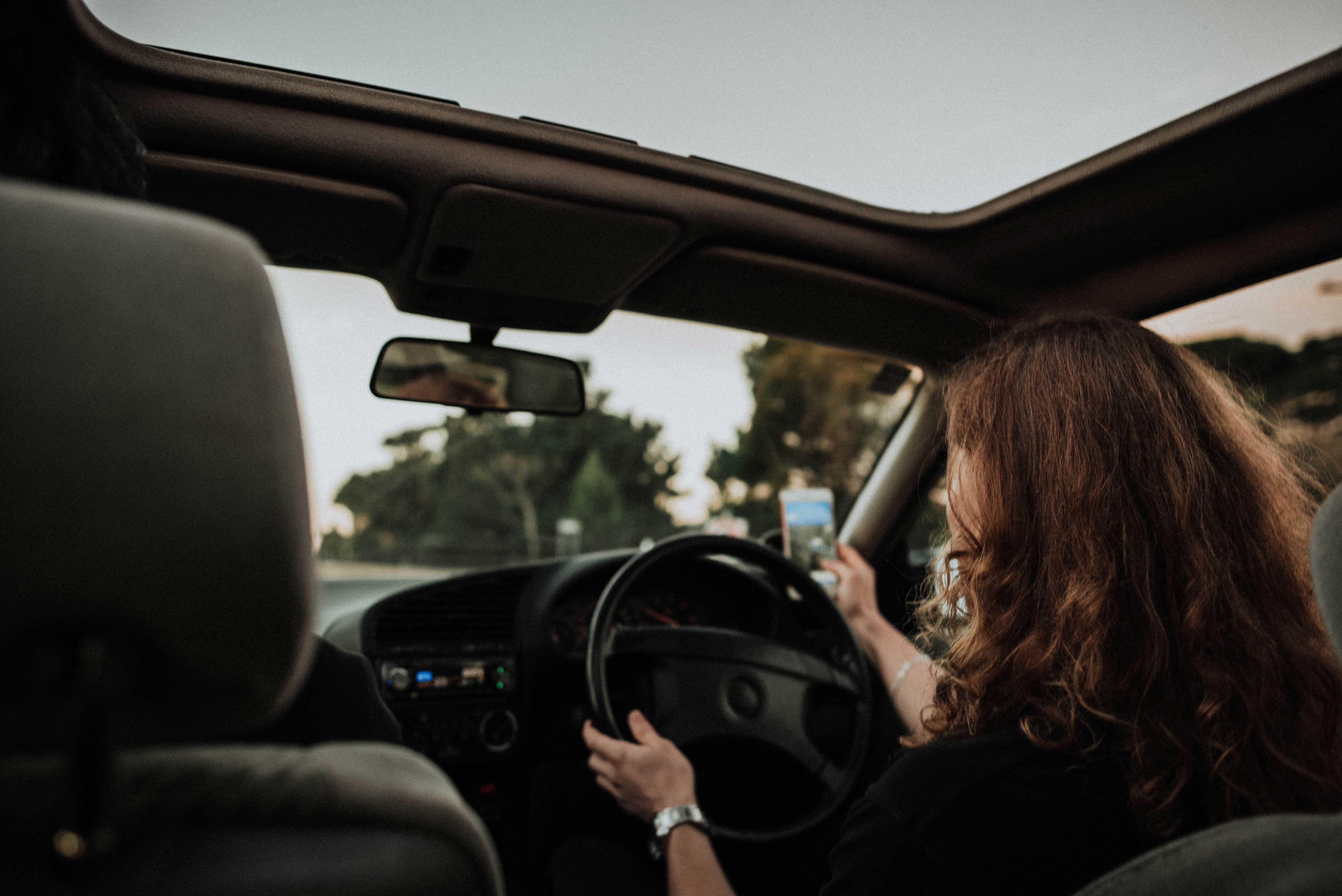 women driving distracted