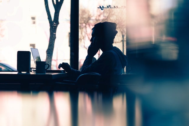 Common Scams to Avoid - person on the phone