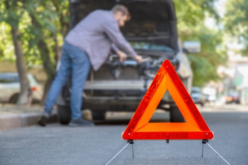 Ford Recalls Over 125,000 Vehicles Due to Engine Failures - engine issues on the side of the road