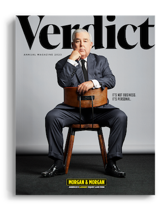 John Morgan and his top staff on the cover of the 2023 Verdicts Magazine