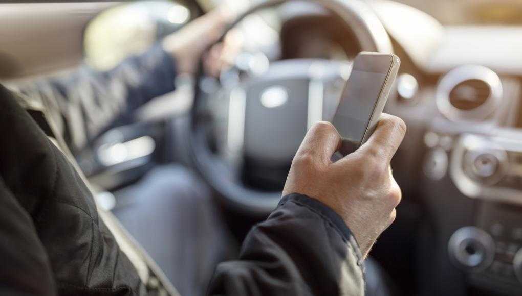 Man texting while driving 