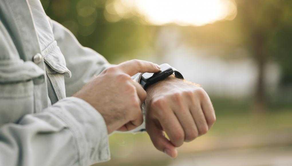 Man looking at his Apple watch