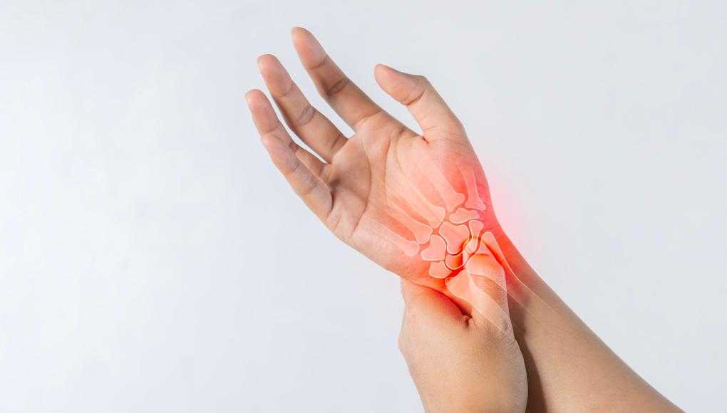 Man holding hand in pain 
