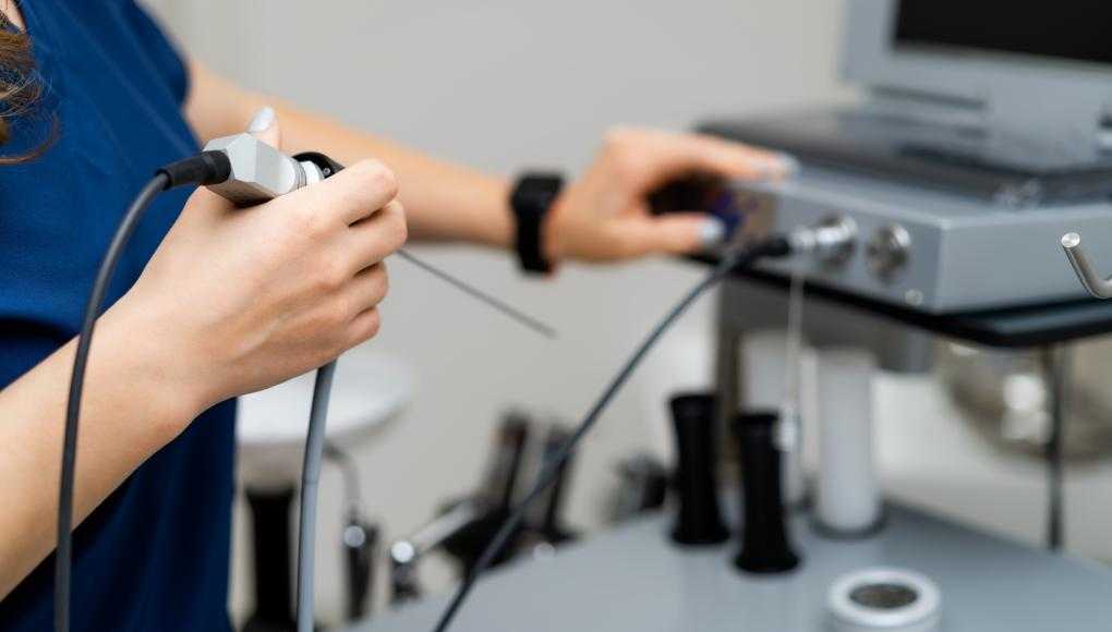 Medical professional using a medical device