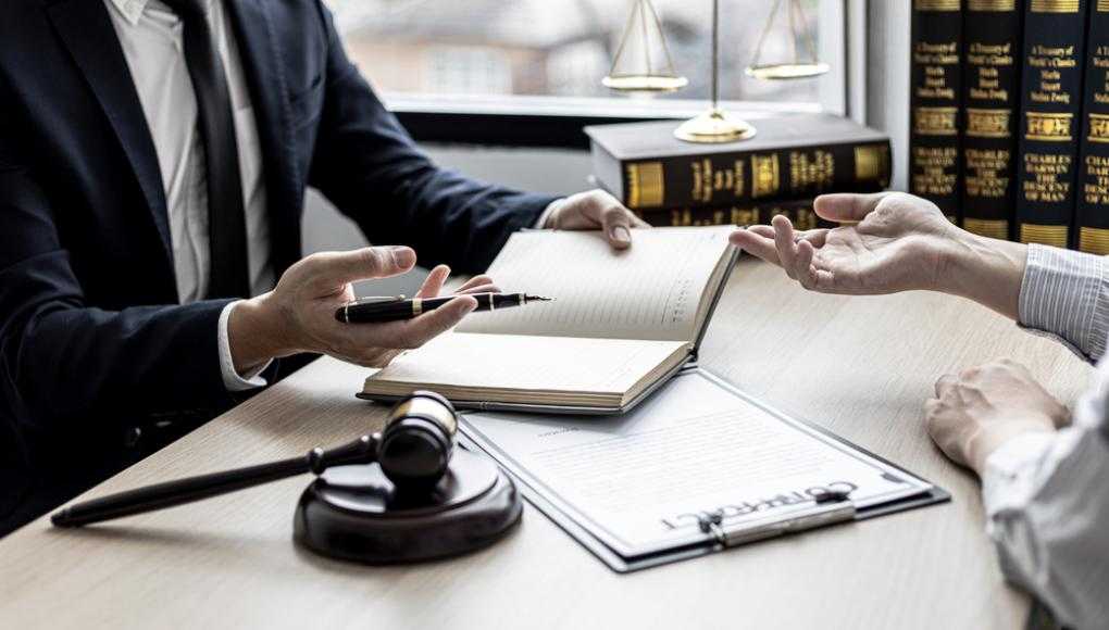 client speaking with lawyer