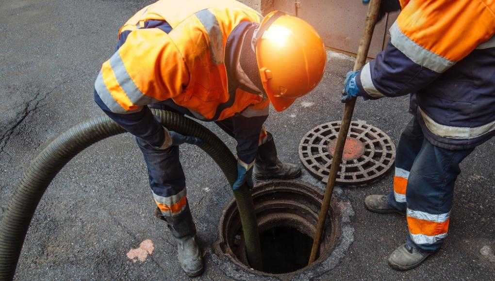 construction worker near a manhole