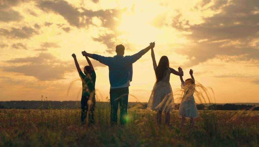 family with a sunset in the background