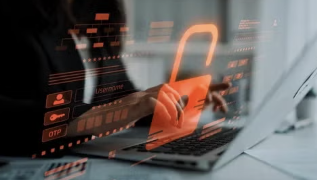 data breach image person on computer