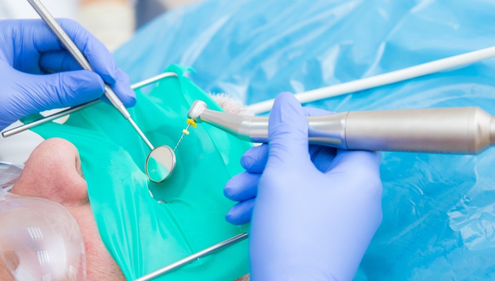dentist filling a patient's tooth