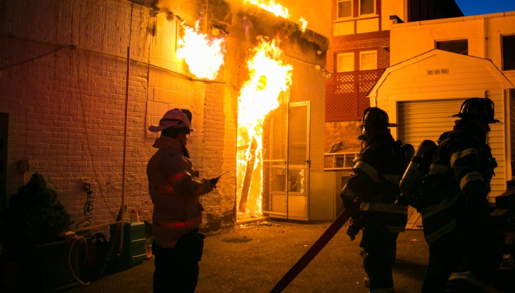 Firefighters outside a house