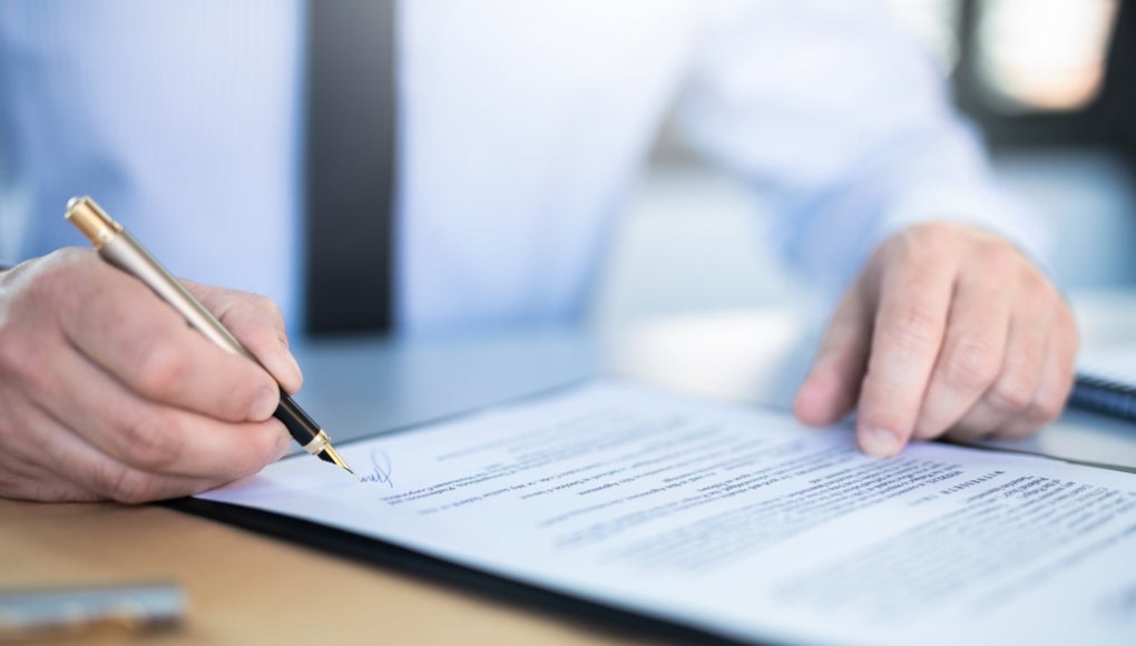 Person signing a contract