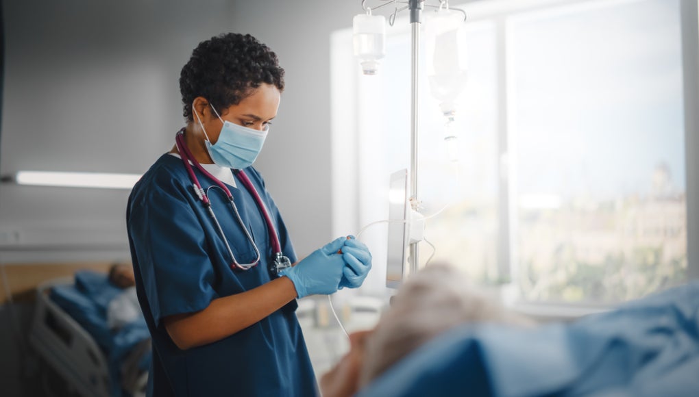 nurse with patient in a hospital room