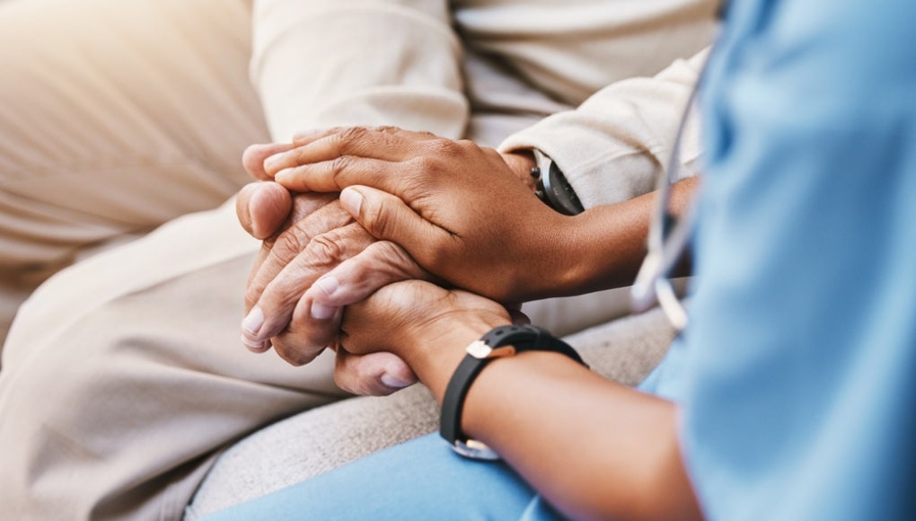 nurse with patient in a hospital room