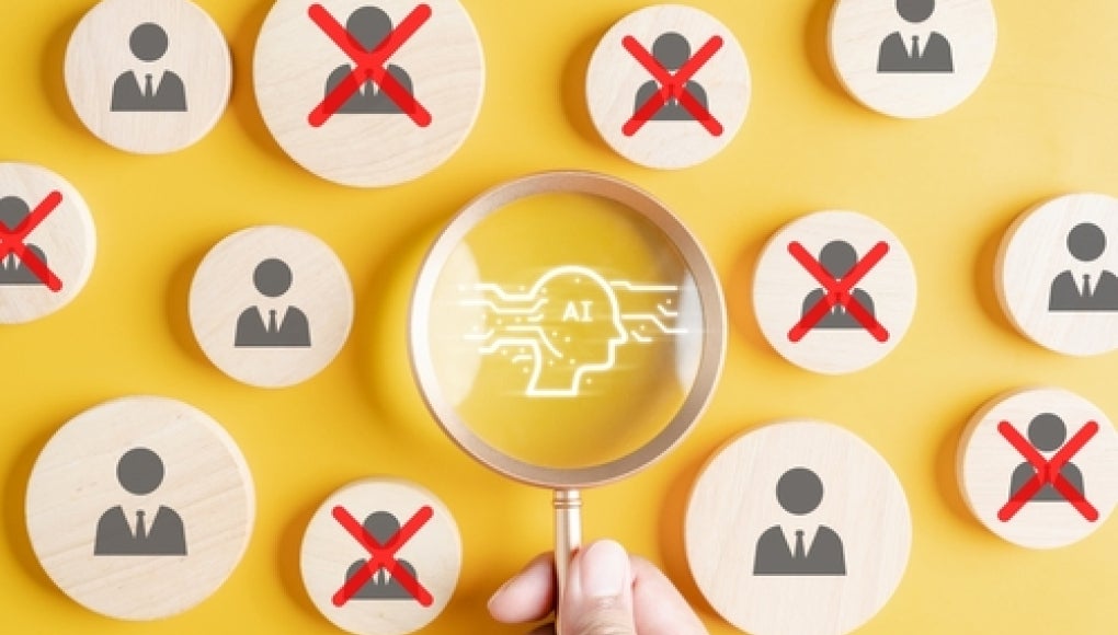 image of a hand holding a magnifying glass with a image of a robot on it, with circles filled with images of peoples being X'd out surrounding it, image has a yellow background