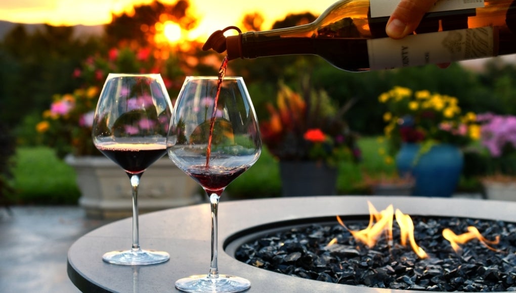 fire pit with wine being poured