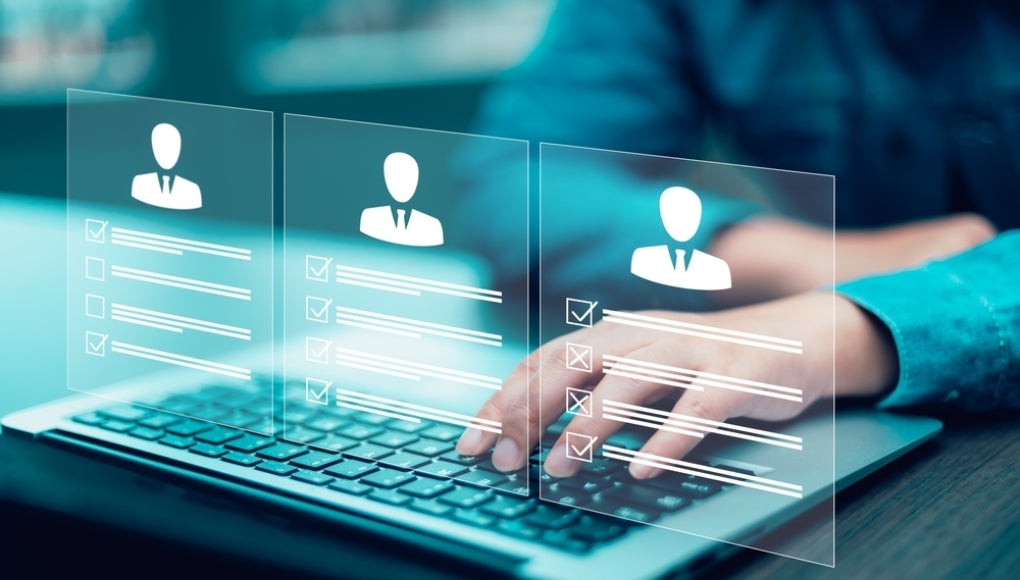 businessman using laptop with Personal information file storage concept ,HR checklists of employees Corporate data management system and document management system with employee privacy. 