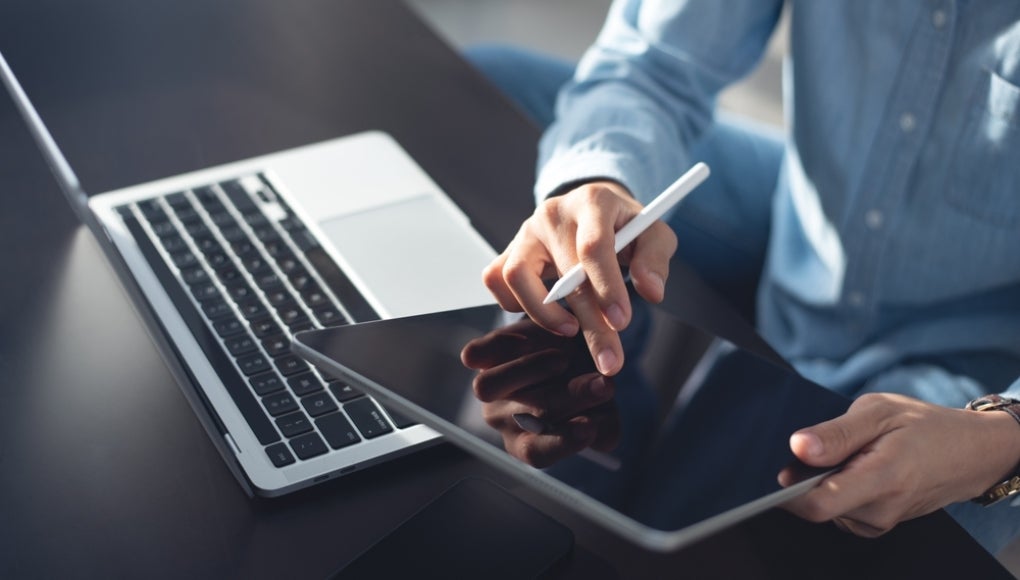 employee using their laptop and working
