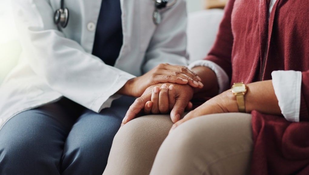 doctor talking to a patient about their cancer diagnosis