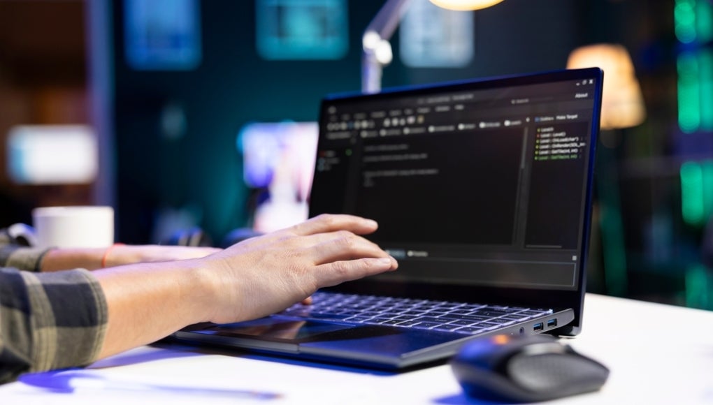 Someone typing on a computer