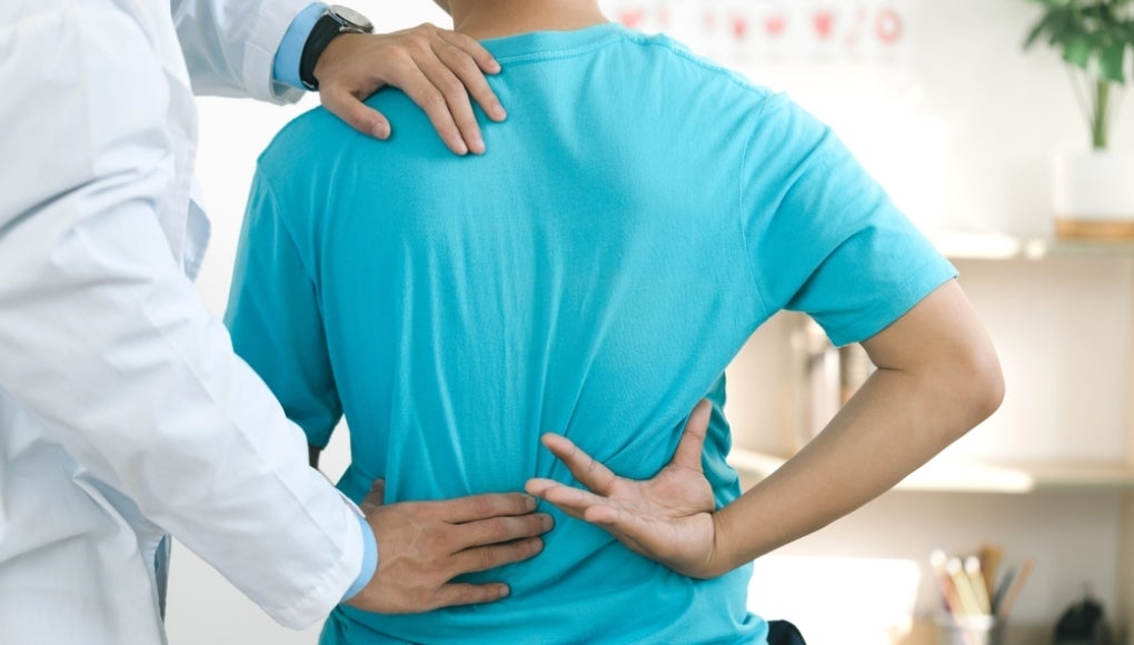 Chiropractor helping a patient