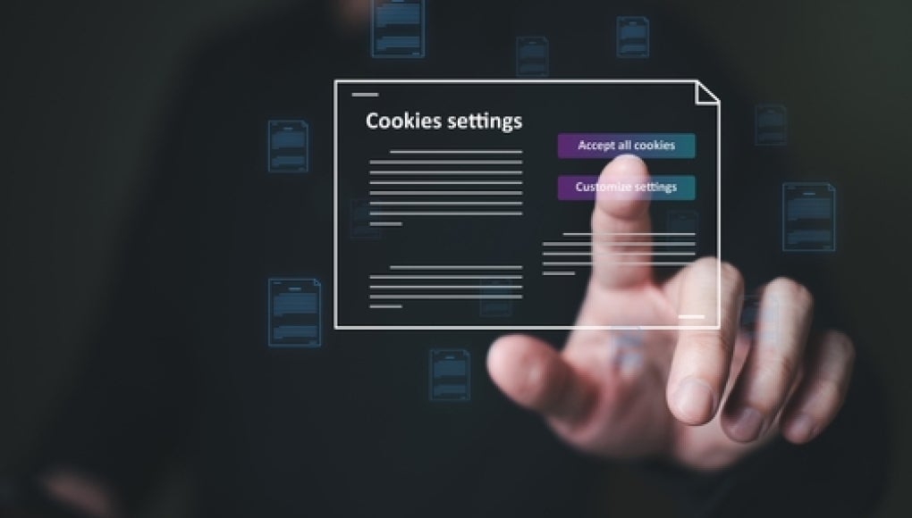 person tapping screen accepting or denying private policy and cookies with a dark background 