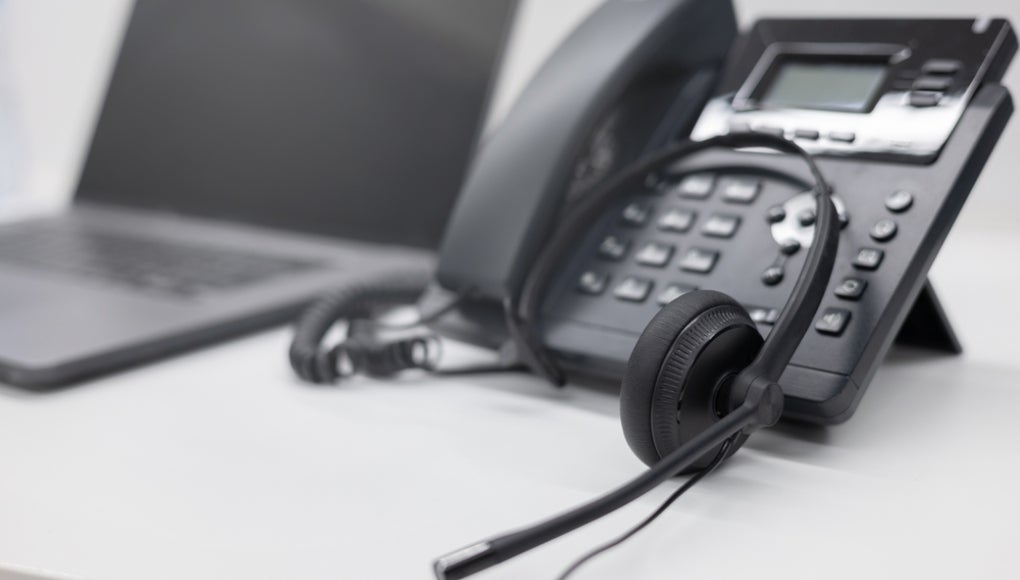 phone with headset in a call center