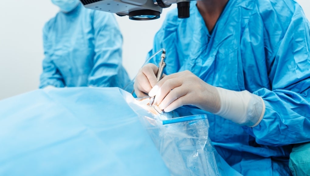 surgeon working on a patient in surgery