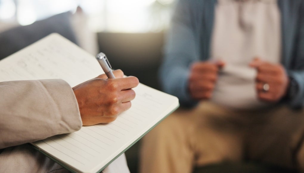 Psychiatrist speaking to a client