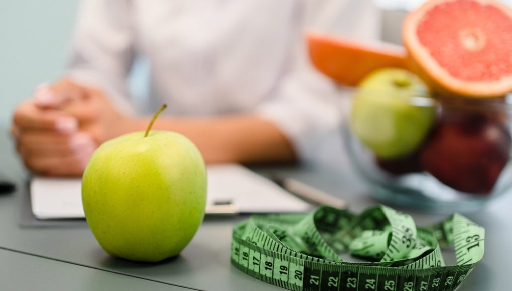 apple, measuring tape and other fruit