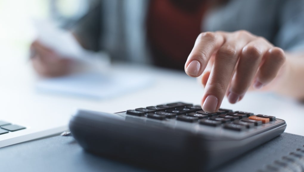 Man using a calculator