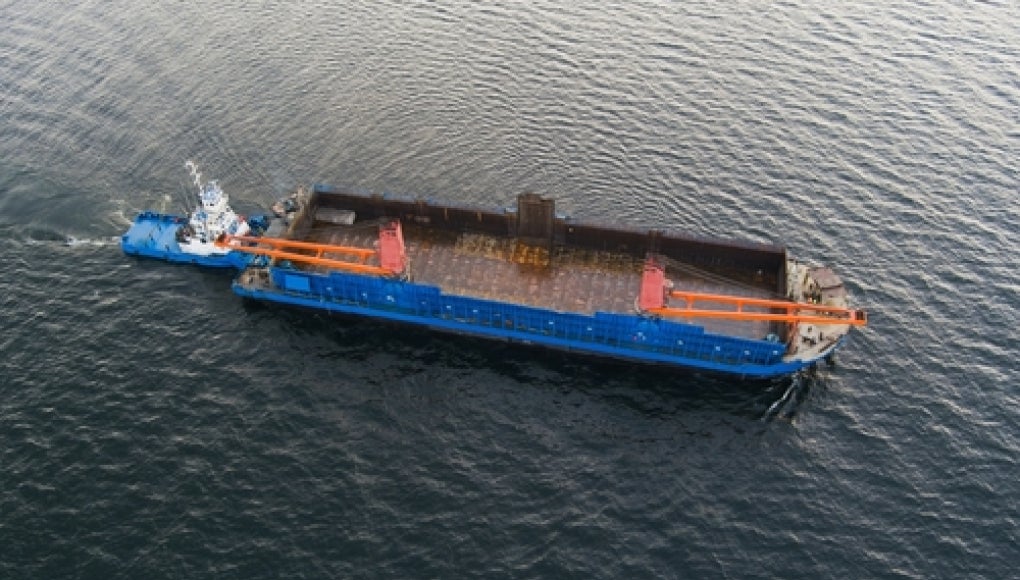 tugboat and barge on water