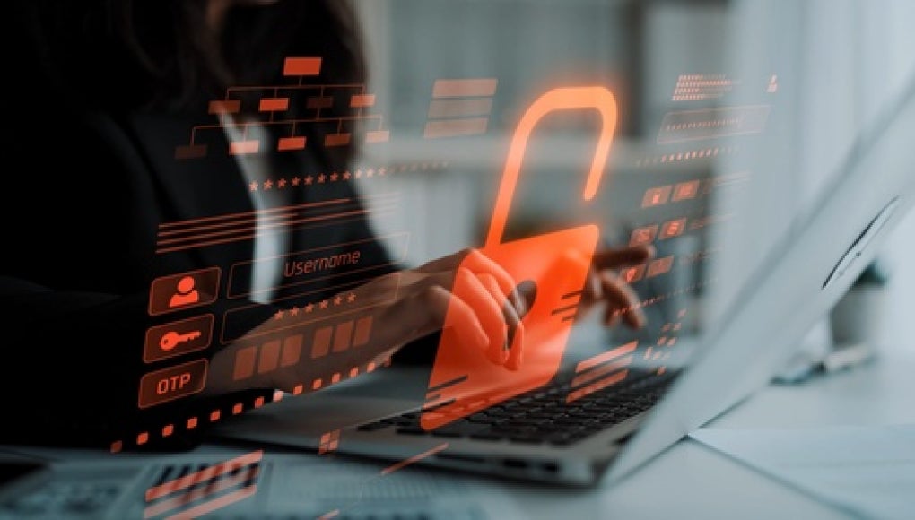 person typing on keyboard with red error appearing on screen 