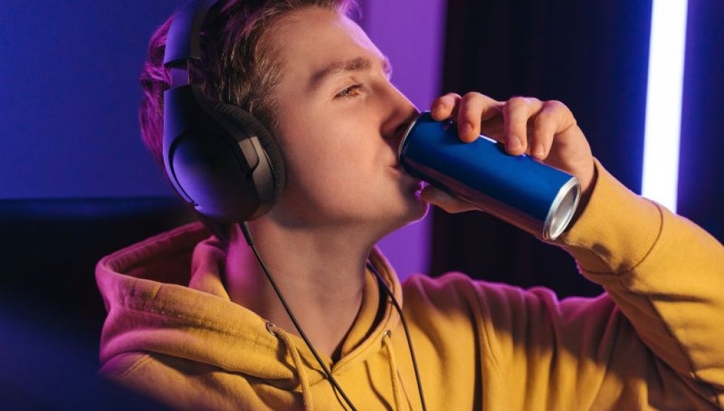 teen drinking energy drink 