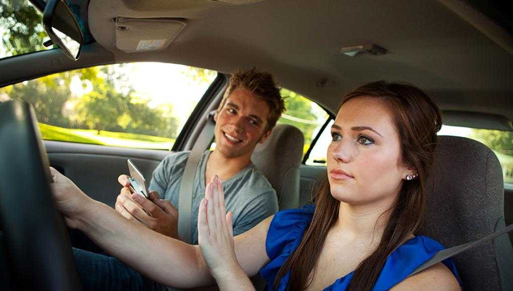 woman ignoring passenger in car