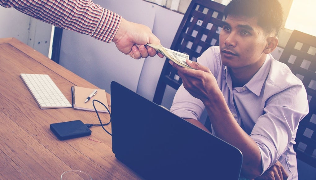 Cash or Comp Time? Which is Better for Employees? - Employee Taking Cash 
