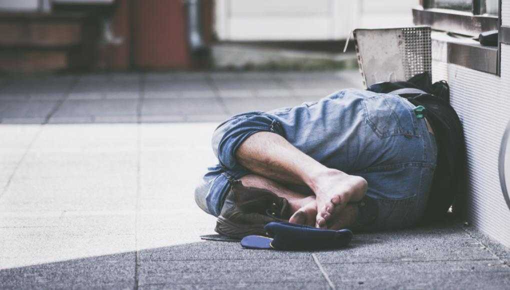 Homeless person on floor