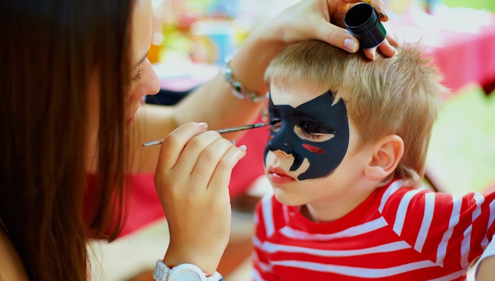 Is Your Child’s Halloween Makeup Tainted with Lead? - An artist applying face painting on a child's face