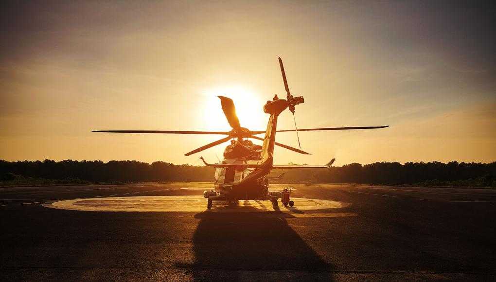 Helicopter against sunset