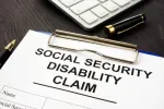 social security disability claim form on a clipboard 