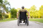 veteran in a wheelchair with their back towards the viewer