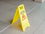 floor with yellow and red caution sign for wet floor